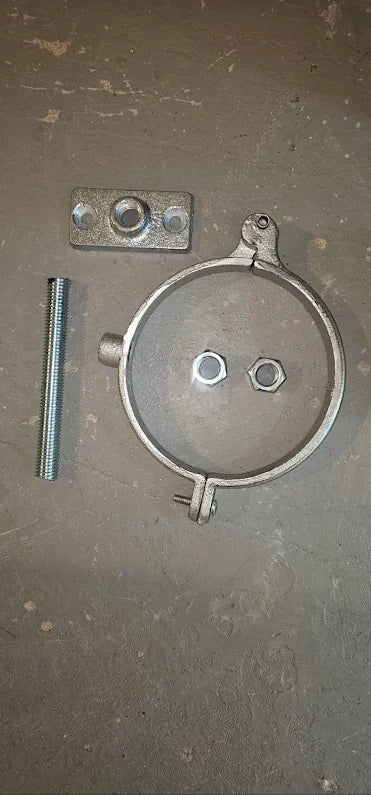 Split ring pipe hanger kit components — hanger ring, threaded rod, wall plate, and nuts laid out