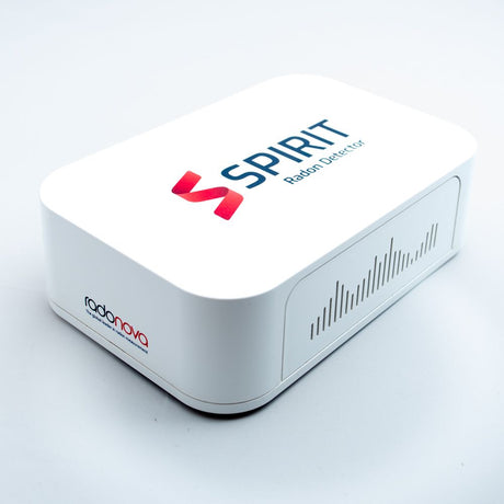 Radonova SPIRIT continuous radon monitor, white rectangular unit with vents along one side, shown at an angle