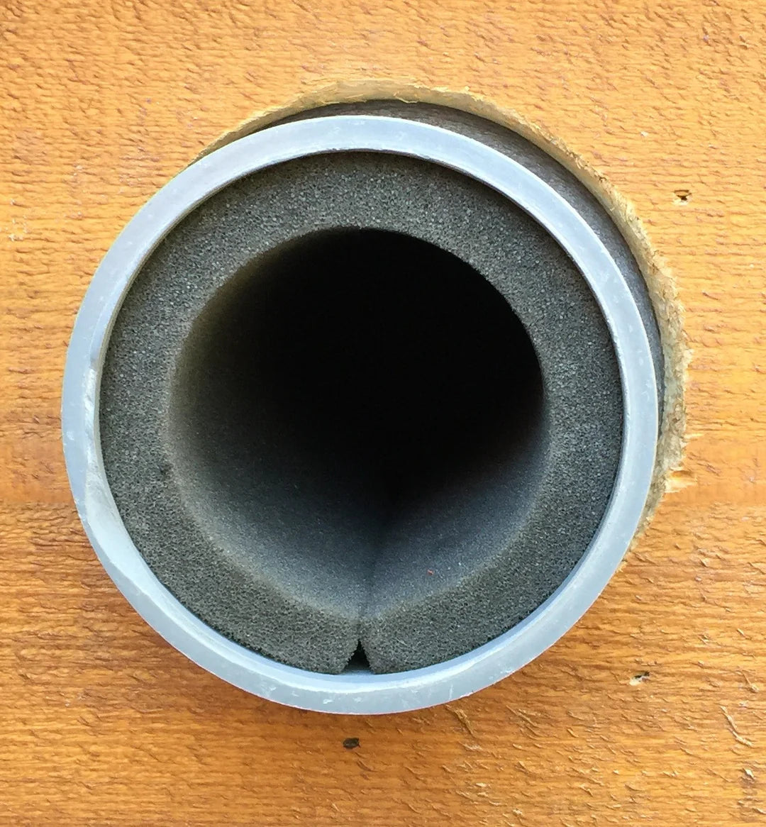 Radon fan muffler foam installed on PVC pipe — noise dampening for sub-slab depressurization systems in Canada